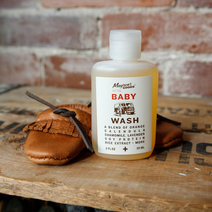 Baby wash bottle with leather baby moccasins 