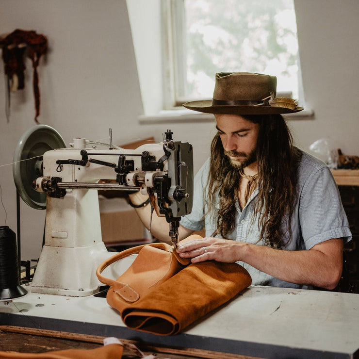 Blaine making the caravan bag inside the Local Branch workshop