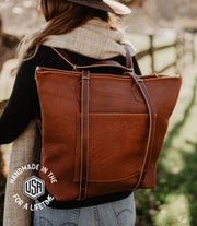 leather backpack converts into an over shoulder tote bag