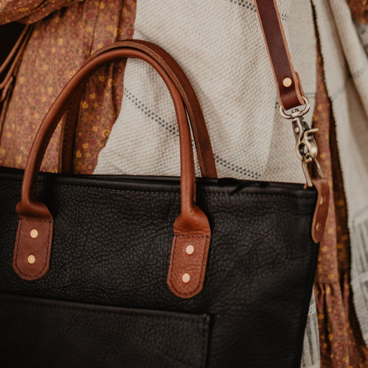 detail shot of caravan bag in black and brown