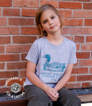 The Finger Lakes Duck T-shirt by Local Branch, worn by a child sitting against a brick wall