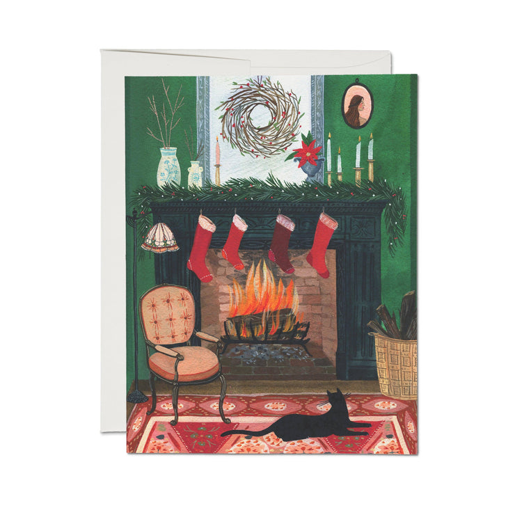 fireplace with stocking and black cat greeting card