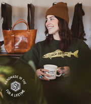 100% cotton forest green crewneck with cream colored screen printed says the local branch New York made in the us
