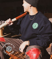 Pine tree on a patch that reads the local branch ny USA made. Green patch with white details. On a black heavy weight 100% cotton crewneck sweatshirt