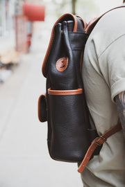 Leather backpack side pocket detail