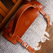 Leather buckle carrier in caramel wool blanket 