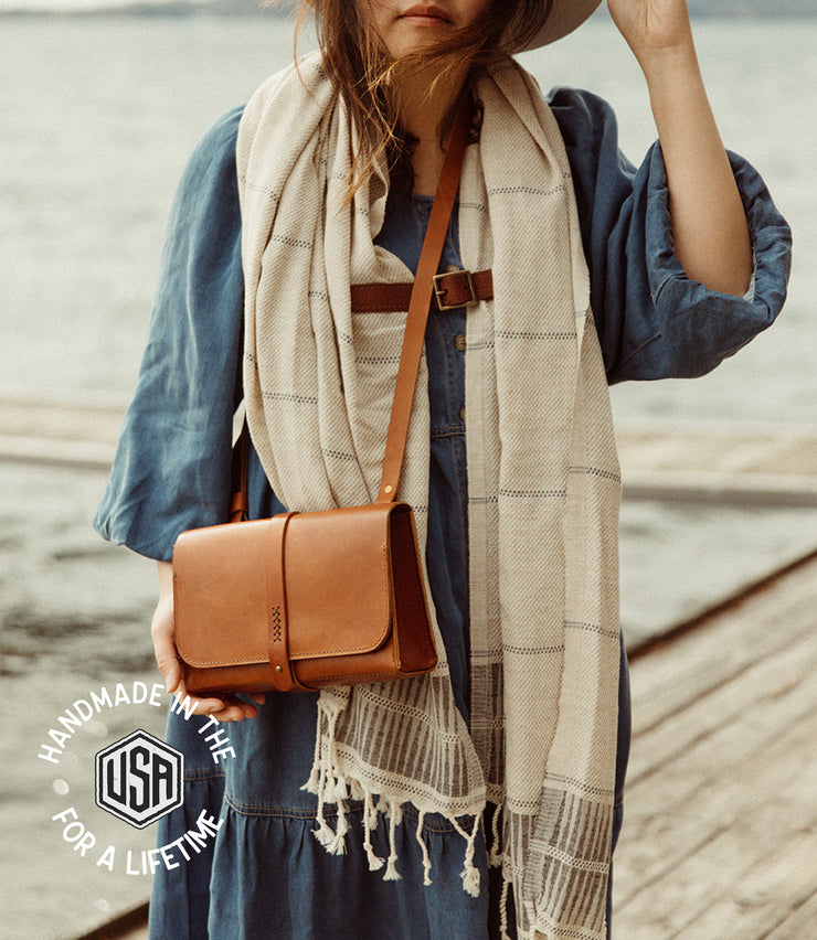 Navigator leather purse on model at the lake