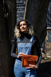 caramel hand laced sides locking snap closure gaucho clutch USA made by the local branch
