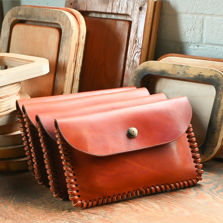 caramel hand laced sides locking snap closure gaucho clutch USA made by the local branch
