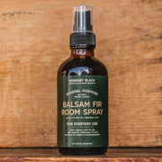 Balsam Fir Room Spray bottle on a wooden background