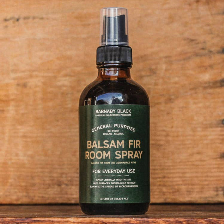 Balsam Fir Room Spray bottle on a wooden background