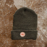 forest green colored beanie with small round patch bison and the local branch usa made